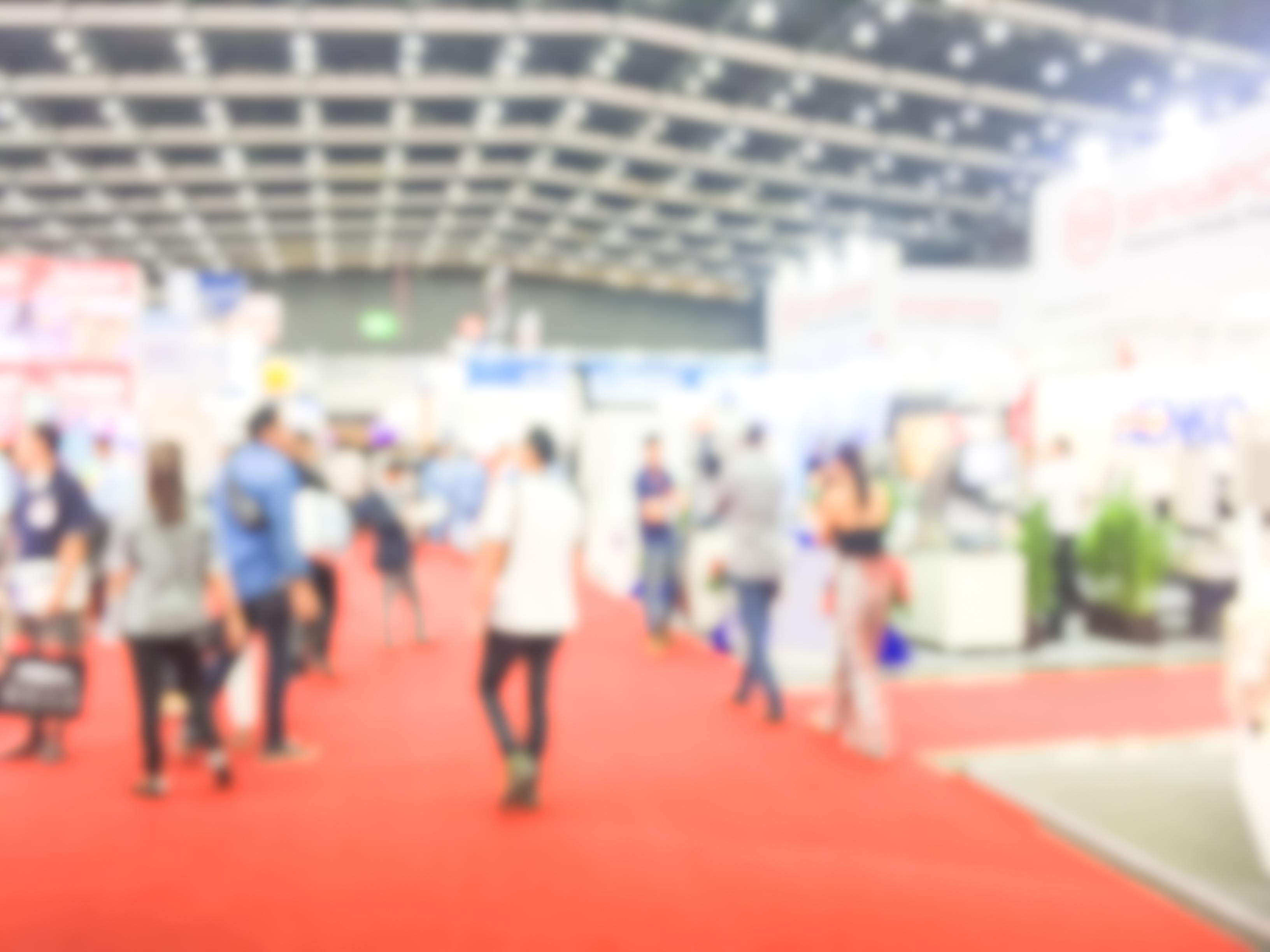 tradeshow floor with people walking around in the background