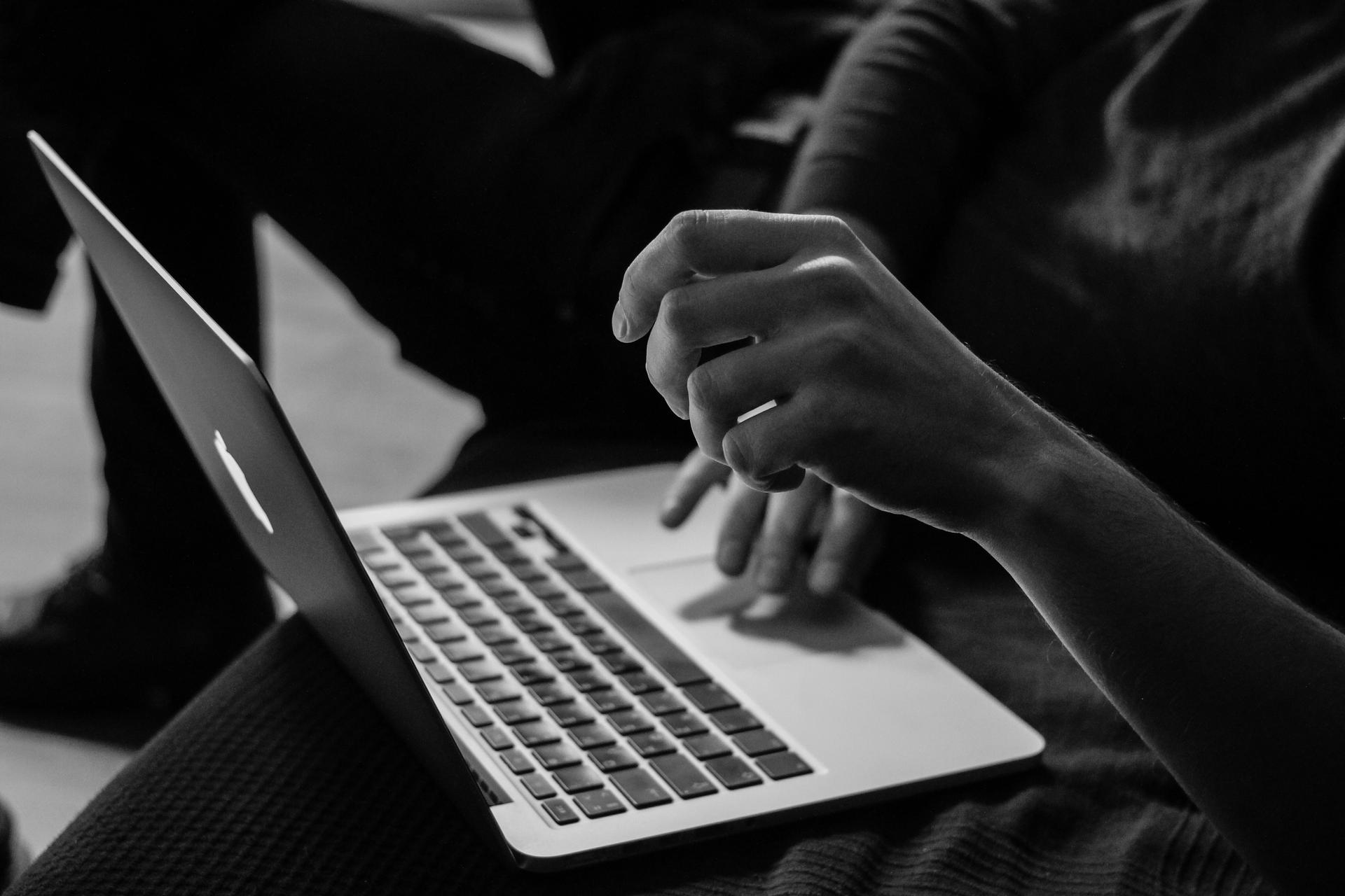 Person using a laptop at work.