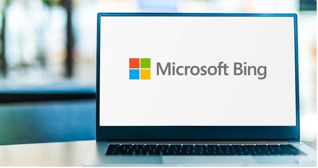 computer with the Microsoft logo on the screen