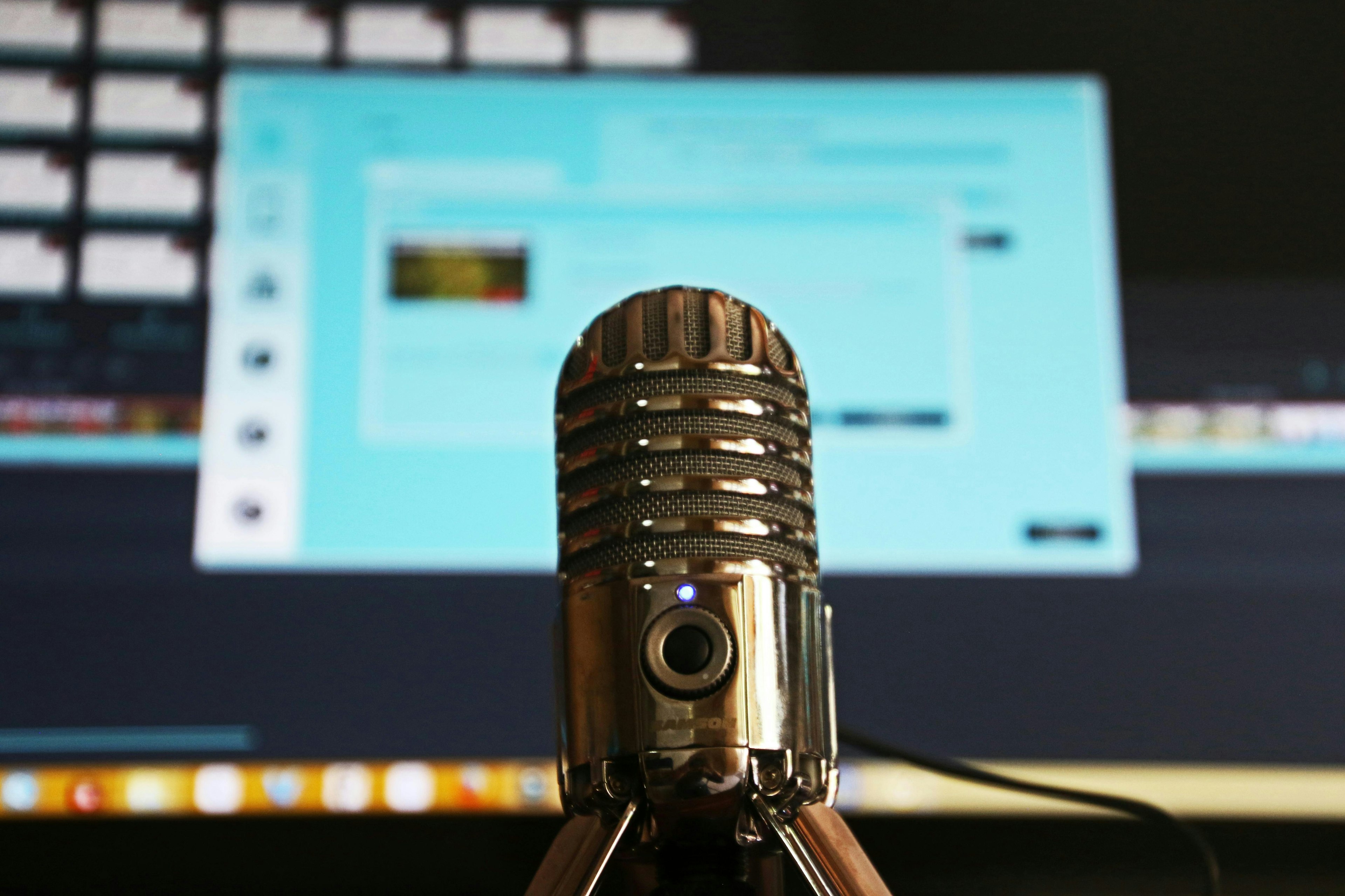 podcast microphone in front of a computer