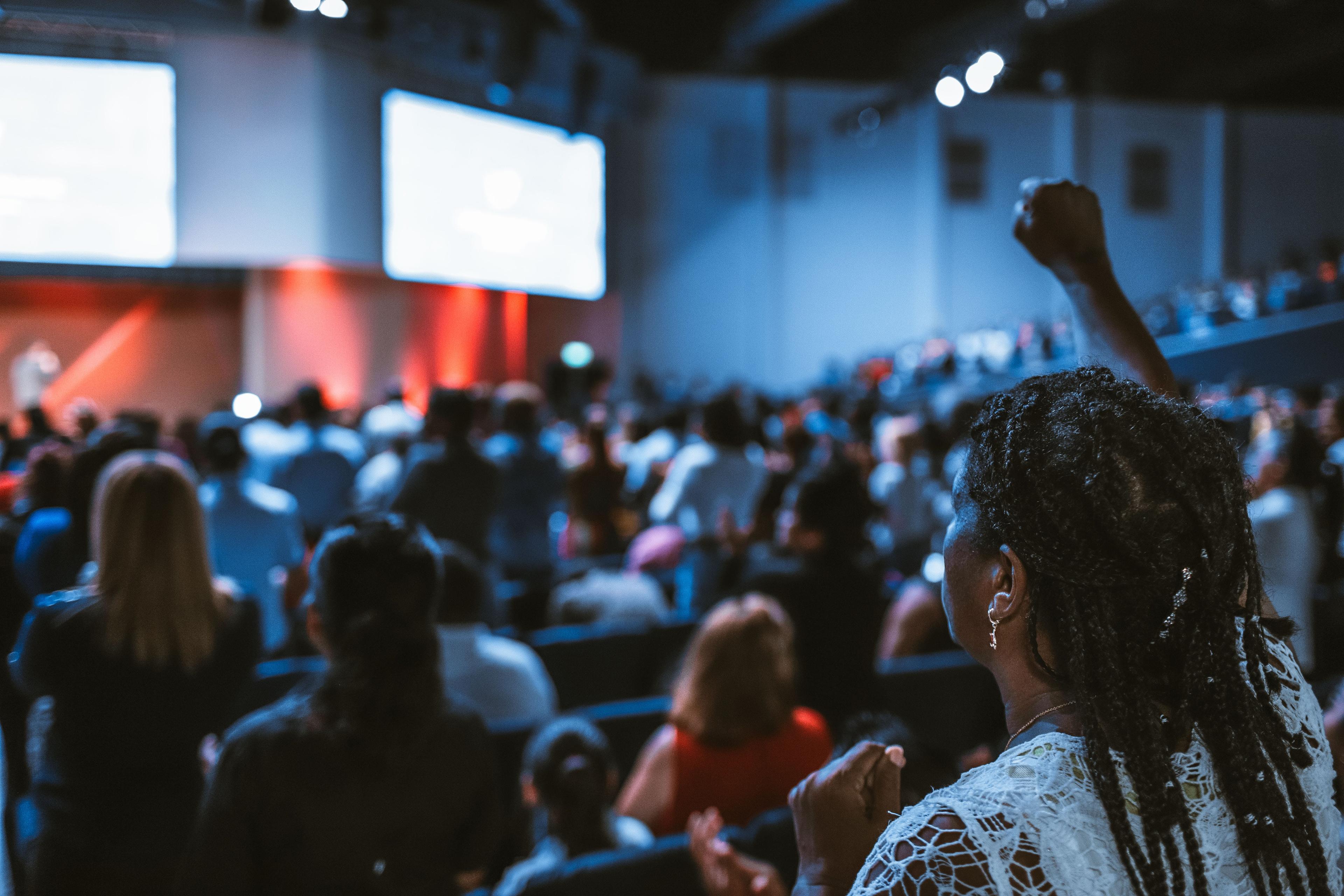 woman sitting at conference
