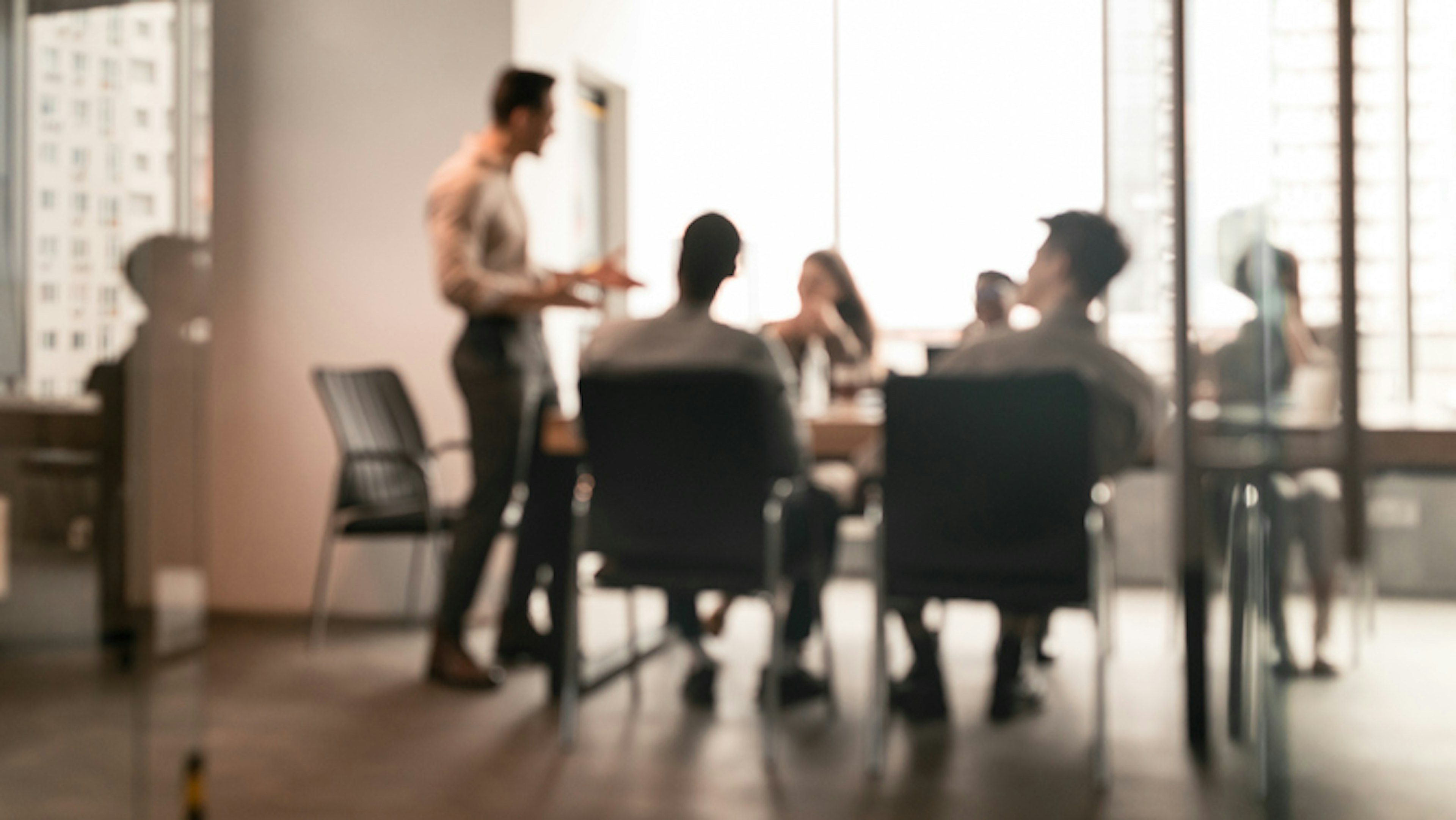 group of people working together at a conference table