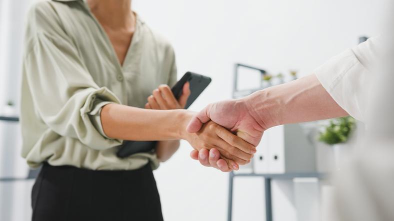 two people shaking hands